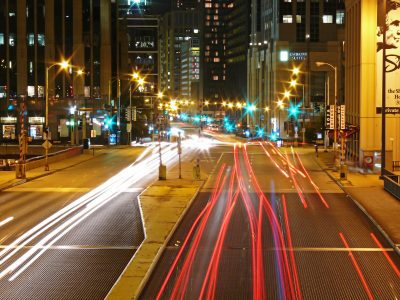 Luxury limousine in downtown Chicago with skyline view.