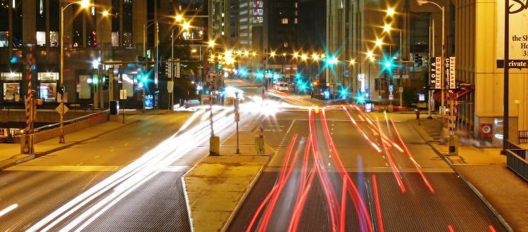 Luxury limousine in downtown Chicago with skyline view.