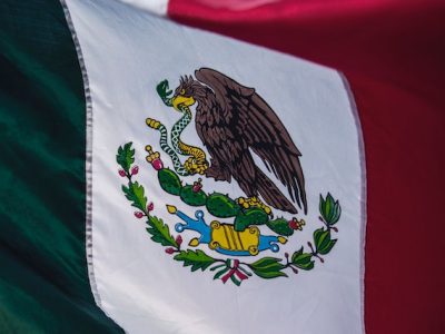 A professional car service navigating smoothly through Chicago's crowded streets during Mexican Independence Day celebrations.