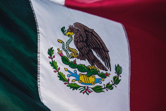 A professional car service navigating smoothly through Chicago's crowded streets during Mexican Independence Day celebrations.